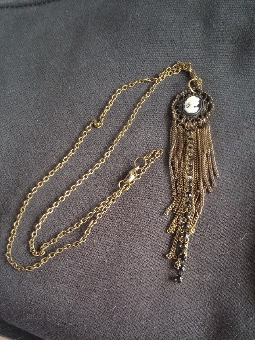 Hand Crafted Gold Cameo Tassel Necklace with Black Accents